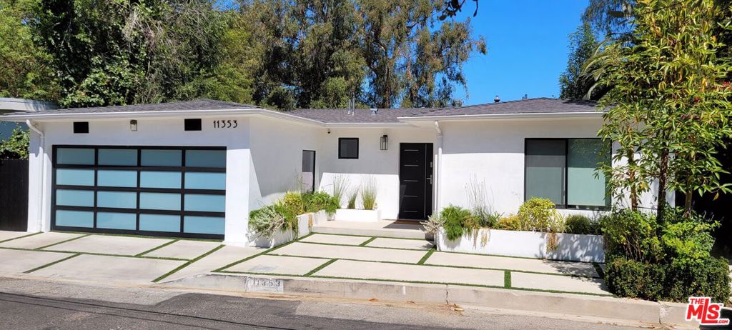 Spectacular sweeping city and tree top views from almost every window. This totally remodeled 4 bedroom 3.5 bathroom contemporary home is ready to be called your home. It features an open space concept with a new gourmet kitchen equipped with state-of-the-art appliances. The dining area looks out on a courtyard and the eat-in kitchen with a built-in breakfast bar leads to the living room with an expansive city view which is sure to impress the most discerning of guests. Blurring indoor and outdoor space the upper deck provides an excellent view of the city and the lower deck is ideal to host a large gathering. The primary en- suite is filled with natural light, stunning views, and walk-in closet. The adjoining en-suite can be used as an additional bedroom or office space. Two first floor bedrooms are easily accessible and bathed in natural light.