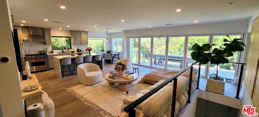 Spectacular sweeping city and tree top views from almost every window. This totally remodeled 4 bedroom 3.5 bathroom contemporary home is ready to be called your home. It features an open space concept with a new gourmet kitchen equipped with state-of-the-art appliances. The dining area looks out on a courtyard and the eat-in kitchen with a built-in breakfast bar leads to the living room with an expansive city view which is sure to impress the most discerning of guests. Blurring indoor and outdoor space the upper deck provides an excellent view of the city and the lower deck is ideal to host a large gathering. The primary en- suite is filled with natural light, stunning views, and walk-in closet. The adjoining en-suite can be used as an additional bedroom or office space. Two first floor bedrooms are easily accessible and bathed in natural light.
