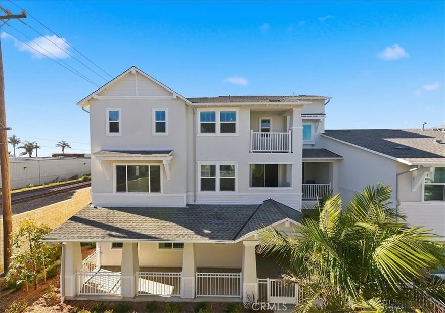 Modern Coastal Luxury Townhome Rare Multi-generational floor plan by the Ocean-NEW CONSTRUCTION-Move-in ready – last homes available! Private end home with large front fenced porch!!  Experience the ultimate in modern coastal living in this stunning end-unit luxury townhome surrounded by lush landscaping, just moments from the ocean. This thoughtfully designed residence combines elegant finishes, open spaces, and flexible living for a multi-generational lifestyle.

Main Level:

Enter through a beautifully landscaped, large fenced front patio that welcomes you into a spacious multi-generational suite complete with a kitchenette area featuring a sink, microwave, mini fridge area, and shaker-style upper and lower cabinets. The ensuite bathroom features a vanity area and a walk-in shower with oversized white tile to the ceiling, creating a serene, spa-inspired coastal vibe. Additional highlights include a storage nook leading into ensuite and a stackable washer and dryer laundry closet in the hallway leading to the multi-generational suite, with easy garage access for convenience.

Second Level:

The open-concept gourmet kitchen is a chef’s dream, featuring Wolf appliances, a large island with bar seating, shaker cabinets, a walk-in pantry, and an open butler’s area with additional prep space and built-in microwave in the lower cabinets. Separate dining area with a private patio, perfect for extended dining, relaxation or entertaining. This level also includes a bathroom with vanity and a private bedroom with a walk-in closet, ideal for guests or a home office.

Third Level:

Upstairs, enjoy a convenient side-by-side laundry closet in the hallway. A secondary bedroom offers a walk-in closet and ensuite bathroom with a tub-shower combo accented by full-height oversized white tile and a shaker vanity with dual sink that continues the home’s coastal aesthetic.

The gorgeous primary suite is a true retreat, featuring two walk-in closets, a private balcony, and a spa-like ensuite with a freestanding soaking tub and a walk-in shower surrounded by oversized white tile to the ceiling.

Throughout the home, large windows fill every room with natural light and provide charming neighborhood views, while the lush landscaping enhances the home’s private, coastal-style.

Don’t miss this opportunity—this move-in ready, beautifully staged home is prepared for buyers today. Last homes available—schedule your private showing before it’s gone!