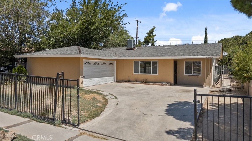 4 bed 2 bath home offering over 1200 square feet of comfortable living space in the heart of Palmdale. This charming single family residence features a spacious layout with natural lighting flowing throughout. The full kitchen is equipped with both tile and laminate flooring, ideal for everyday use and easy maintenance. A vintage fireplace serves as a warm focal point in the living area, adding character and charm. The expansive backyard provides plenty of room for outdoor enjoyment, entertaining, or future enhancements. A wonderful opportunity to own a well maintained and inviting home in a convenient location! Section 8 Welcome!