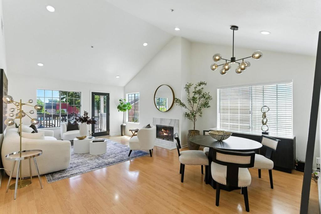 Nestled in the heart of Belmont, this bright & spacious condo-style townhome offers approx. 1,585 sq. ft. of well-designed living space. The updated kitchen showcases stainless steel appliances, sleek white cabinetry, designer backsplash, recessed lighting, & luxury vinyl flooring opening seamlessly to a generous living and dining area with soaring ceilings, a cozy fireplace, and access to a balcony. The home features three comfortable bedrooms, including a large upstairs primary retreat with vaulted ceilings, a walk-in closet with attic access, a balcony, and a versatile office or sitting nook. The en-suite bathroom offers dual sinks, both a tub and a separate stall shower. On the main level, two additional bedrooms share a full bathroom, ideal for guests or a home office setup .Enjoy the convenience of in-unit laundry room, ample storage throughout, a 1-car garage, and 1 additional assigned parking space. The Sterling Point community is beautifully landscaped with mature foliage, open green space, and a charming gazebo. Located just minutes from Twin Pines Park, Caltrain, Safeway, and major commuter routes, this home also lies within the acclaimed Belmont-Redwood Shores school district.