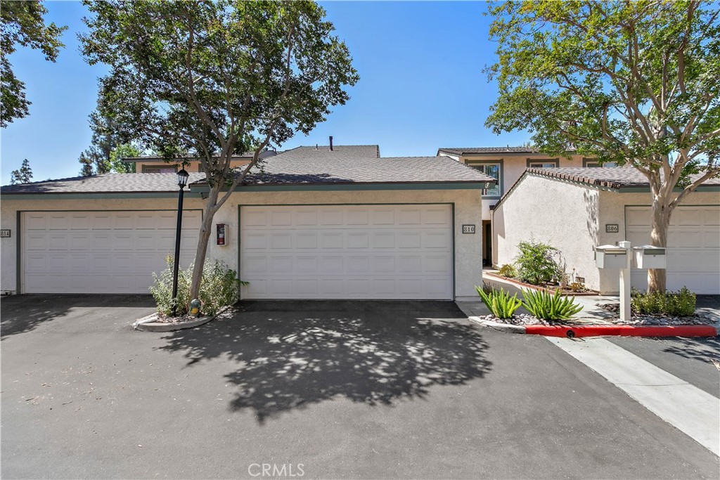 Welcome to Sierra Palms—where comfort, convenience, and community come together! This beautifully maintained two-story condo offers 4 spacious bedrooms and 3 baths, including a powder room downstairs and both a full and ¾ bath upstairs. The main-level bedroom features custom built-in cabinetry, making it an ideal space for a home office, creative studio, or guest retreat. Step into the bright and inviting living area that flows effortlessly into the dining space and out to the private, covered patio—perfect for seamless indoor-outdoor living. The charming front courtyard adds a touch of tranquility, while the detached two-car garage provides privacy and additional storage options, including a handy under-stair closet.
The thoughtfully designed kitchen includes all major appliances—refrigerator, stove, microwave, dishwasher, washer, and dryer—making this home truly move-in ready. Residents of the sought-after Sierra Palms community enjoy resort-style amenities including a sparkling pool, basketball court, barbecue area, and ample guest parking. Conveniently located less than half a mile from Azusa Pacific University and Citrus College, and just minutes from the Metro Gold Line and 210 Freeway.
Don’t miss the opportunity to live in one of the most desirable communities in the area—schedule your private tour today!