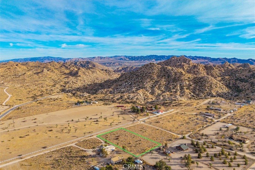 Discover an extraordinary opportunity to own in the heart of Pioneertown. These spacious vacant buildable lot is situated just a short walk from the iconic Pappy & Harriet's and other historic sites, offering both convenience and charm. Surrounded by stunning natural landscapes, the property provides an ideal setting for building your dream home with breathtaking views of rugged desert mountains. Whether you're looking for a tranquil escape or a vibrant spot near Pioneertown's lively cultural hub, this parcel of land is a rare gem waiting to be transformed into something truly special. Don’t miss your chance to own a piece of this iconic desert sanctuary. Adjoining parcel with paid water meter available too.