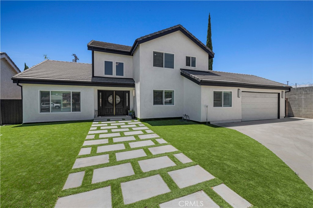 5-Bedroom Chatsworth Home with Dual Master Suites, Spacious Lot.
Tucked away at the end of a quiet cul-de-sac in desirable Chatsworth, this stunning 5-bedroom, 4-bathroom residence offers 2,668 sq ft of beautifully updated living space on a generous 9,292 sq ft lot. Designed for modern living and comfort, this home has been thoughtfully updated inside and out.
The property features a newly finished exterior with clean white plaster and brand-new hardscaping in both the front and back yards, complete with decorative turf—low-maintenance and water-efficient with no landscaping upkeep needed. The title reflects 4 bedrooms and 4 full bathrooms, but the formal dining room has been converted into a versatile 5th room—perfect as a guest room, office, studio, or easily restored to its original purpose.
Step inside to soaring high ceilings, elegant spiral staircase, recessed lighting, double-paned windows, and upgraded finishes throughout. Enjoy year-round comfort with a brand-new HVAC system and tankless water heater.
This unique layout includes two master suites, one conveniently located on the main floor and another upstairs—ideal for multigenerational living. In total, there are 2 bedrooms and 2 full bathrooms downstairs, and 3 bedrooms and 2 full bathrooms upstairs.
The converted garage offers endless possibilities as a home gym, studio, man/woman cave, or can easily be returned to garage use. The spacious driveway provides ample off-street parking for multiple vehicles.
Outdoor entertaining is effortless with a built-in BBQ and covered gazebo, creating the perfect setting for weekend gatherings.
Don't miss the opportunity to own this versatile and beautifully upgraded home in a sought-after neighborhood—just minutes from schools, shopping, dining, and the 118 freeway.
Schedule your private showing today!