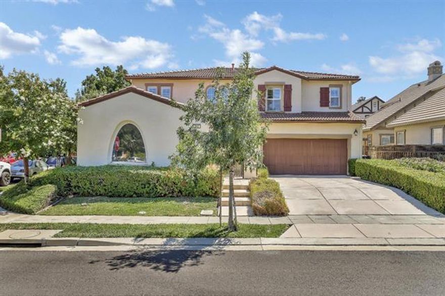 New Price !  :Beautiful Bethany Village home on a corner lot, gated front courtyard, features fresh 2-tone painted interior, plantation shutters, alarm system, kitchen has a butler pantry, slab granite counters, island, gas cooktop, under cabinet lighting, double-sided gas fireplace in nook & FR, 4 BR plus large loft, 1 BR down, master has 2 separate vanities, granite counters, soaking tub, stall shower, walk-in closet with 2 doors, hall bath also has granite counter, 2 sinks & tiled flooring, laundry room includes granite counter, utility sink & extra cabinetry, finished & painted 3-car (2/1 split) garage with opener, backyard has patio and palm trees (Robillini's & banana). Sharp home that is ready to move in to. Highly-rated schools.