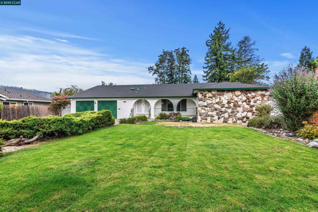 Lovingly maintained by original owners, this roomy home is offered for the very first time. With flat yard—one of the largest in the neighborhood—this property represents the ultimate opportunity set back from the street in a premier location. Recent inspections & termite clearance provide peace of mind, leaving you free to move right in or focus on personalizing the home. The living room is filled with natural light while the formal dining room easily accommodates large gatherings. The kitchen features double ovens, gas range, pantry, and a sunny breakfast nook with garden views with adjacent family room. The bedroom wing includes primary suite with en suite bath, BR 2 offers serene backyard views, while BR 3 & 4 have been reconfigured with additional bath facilities for flexible use. Outdoors, the property truly shines. A shaded patio, wood deck, idyllic gazebo, outdoor barbecue area and a putting green create endless opportunities for entertainment and relaxation. The yard is dotted with an abundance of fruit trees and shade trees with a powered, watertight outbuilding for so many uses. With its solid construction, generous living areas, extraordinary lot, possible ADU spaces and 10-rated Foothill High School, this property is ready for its next chapter