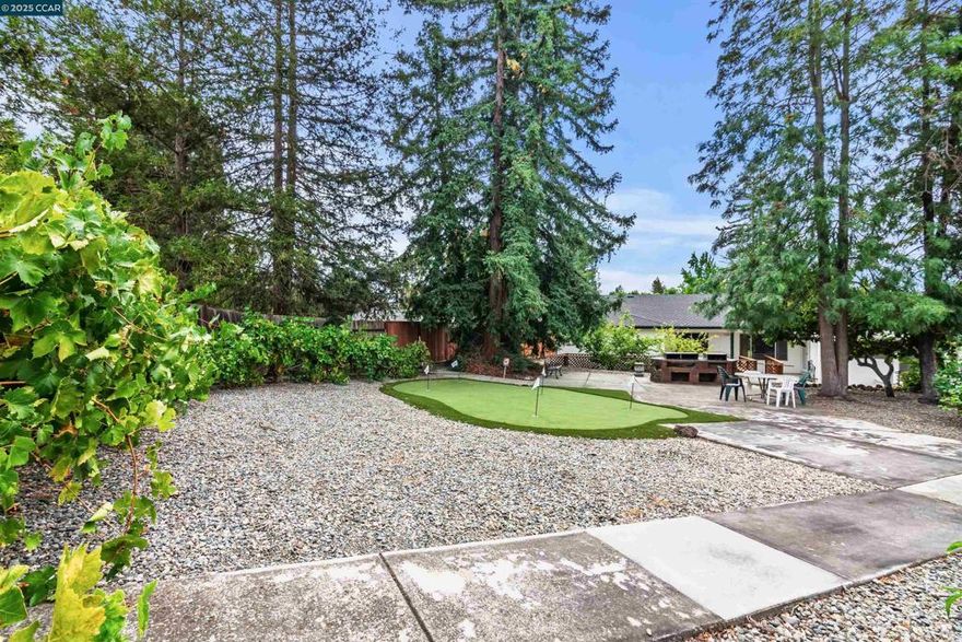 Lovingly maintained by original owners, this roomy home is offered for the very first time. With flat yard—one of the largest in the neighborhood—this property represents the ultimate opportunity set back from the street in a premier location. Recent inspections & termite clearance provide peace of mind, leaving you free to move right in or focus on personalizing the home.  The living room is filled with natural light while the formal dining room easily accommodates large gatherings. The kitchen features double ovens, gas range, pantry, and a sunny breakfast nook with garden views with adjacent family room. The bedroom wing includes primary suite with en suite bath, BR 2 offers serene backyard views, while BR 3 & 4 have been reconfigured with additional bath facilities for flexible use. Outdoors, the property truly shines. A shaded patio, wood deck, idyllic gazebo, outdoor barbecue area and a putting green create endless opportunities for entertainment and relaxation. The yard is dotted with an abundance of fruit trees and shade trees with a powered, watertight outbuilding for so many uses. With its solid construction, generous living areas, extraordinary lot, possible ADU spaces and 10-rated Foothill High School, this property is ready for its next chapter