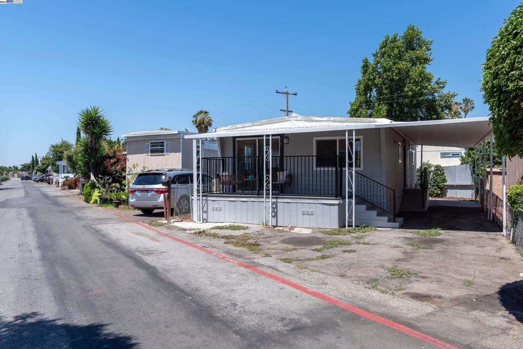 Luxury Living At Its Finest, This Picture Perfect Double Wide Manufactured Home Has Been Newly Renovated In 2025. Interior Includes 800 Of Living Sq Ft, 2 Bed, 1 Bath With An Open Floor Plan, Dining Area, Cozy Family Room With Access To The Front Deck. Upgrade Includes NEW Wall Texture, Designer Paint, Recessed LED Lights, New Electrical Outlets, Wall Switches, Bedroom Doors, Handles, Baseboards and Waterproof Vinyl Flooring Throughout. Kitchen Has NEW Shaker Cabinetry, Quartz Countertops, Subway Backsplash Tiles, Stainless Steel Appliances With An Island. Bathroom Are Upgraded With NEW Shower Faucets, Quartz Shower Panels & Large Vanity. Exterior Upgrades Include NEW Roof, Gutters, Downspouts, Dual Pane Windows, Two Tone White & Gray Paint, Refinished Deck. New Central Heating furnace With Swamp Cooler. A New Stackable Laundry Area With Pantry. Car Awning With Rare 2+ Parking Space !! Low Maintenance Landscaping In Back Yard. This Home Shows Like A Model Home !! Conveniently Located Near Healthcare, Shopping, Restaurants And Freeway Access. Fireplaces: NO