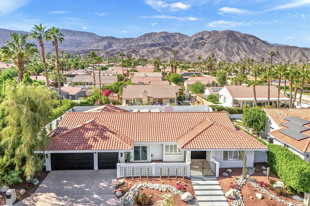 Welcome to this stunning completely move in ready 3-bedroom, 3.5-bath entertainer's paradise located in the highly sought-after no HOA South Palm Desert neighborhood.Thoughtfully remodeled with attention to every detail, this home boasts an open floor plan perfect for both relaxation and entertaining, and it comes equipped with solar panels, offering energy efficiency and reduced utility costs.The chef's dream kitchen is the centerpiece of the home, featuring custom cabinetry, brand new stainless steel appliances with bronze finishes, a large 6-burner stove, electric convection oven, double island with bar seating, and a custom microwave drawer. With three ovens in total, this kitchen is fully equipped for any culinary adventure. Direct access to the private, gated front courtyard makes indoor-outdoor entertaining seamless.The home boasts two spacious suites - a luxurious master and a junior suite along with a third bedroom- each featuring its own en suite bathroom with custom vanities and beautifully redone showers. The living room flows effortlessly into the large family room featuring a bar and powder room, creating ample space for all gatherings.Step outside to your desert oasis, where the backyard offers a serene space complete with desert landscaping, a putting green, covered patio, and plenty of room for lounging by the pool.Located just minutes from highly rated Washington Charter School, El Paseo shopping, Westfield Mall, Whole Foods, and more, this home truly has it all!