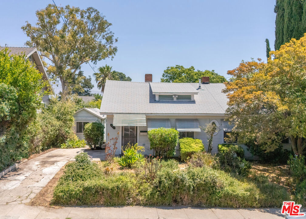 On the market for the first time since 1988, this classic Highland Park home situated in a highly desired neighborhood is ready for its next chapter. The main house offers 1,410 square feet with 3 bedrooms and 2 bathrooms, plus a bonus room perfect for a home office, studio, or creative retreat. In addition, the converted detached garage serves as a guest house with its own kitchen space, living area, and bathroom, adding flexibility for visitors or rental income. Set on a generous 6,684 square foot lot in a special hillside setting, the property enjoys lovely neighborhood views that add to its unique charm. The floor plan has great flow and endless possibilities, while the spacious backyard with avocado trees invites entertaining, gardening, or future expansion. Brimming with character details and tremendous upside, this fixer is surrounded by beautifully renovated homes commanding much higher sale prices. A pre-inspection report is available to help you plan your renovation and build instant equity. Bring your ideas and vision to transform this Highland Park gem nestled in a serene spot yet walking distance to the best of York & Figueroa's cafes, shops, and the Metro Line.