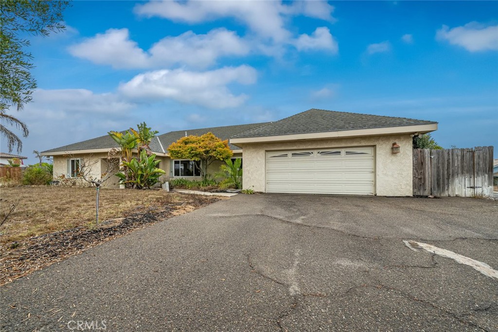 Welcome to this beautifully updated 5 bed/3 bath home, perfectly situated on a large corner lot in a quiet Nipomo neighborhood. Just a short stroll from Nipomo Regional Park, you’ll enjoy easy access to trails, sports fields, and year-round outdoor activities. Step inside to discover new vinyl plank flooring throughout the main level, adding a fresh, modern touch. The open floor plan offers a spacious living room with a cozy fireplace plus a sunlit flex room near the entry, ideal as a dining area, home office, or additional lounge space. The main-floor primary suite features a spa-like bathroom with a soaking tub, dual vanities, and a walk-in closet. Two additional bedrooms and a full bath complete the main level, while upstairs you’ll find two more bedrooms and another full bath, perfect for guests or multi-generational living. The property offers exceptional outdoor space with two separate driveways: one leading to the two-car garage and the other to gated RV parking. The expansive backyard is ideal for entertaining, play, or pets, with ample room for gatherings and even potential to explore an ADU addition (check with the city). With its prime location, flexible floor plan, and rare extra parking, this home is ready to accommodate all your hobbies, toys, and lifestyle needs. Don’t miss your chance to own this Nipomo gem. This is the perfect house hack or home for multi-generational living. Schedule your showing today!