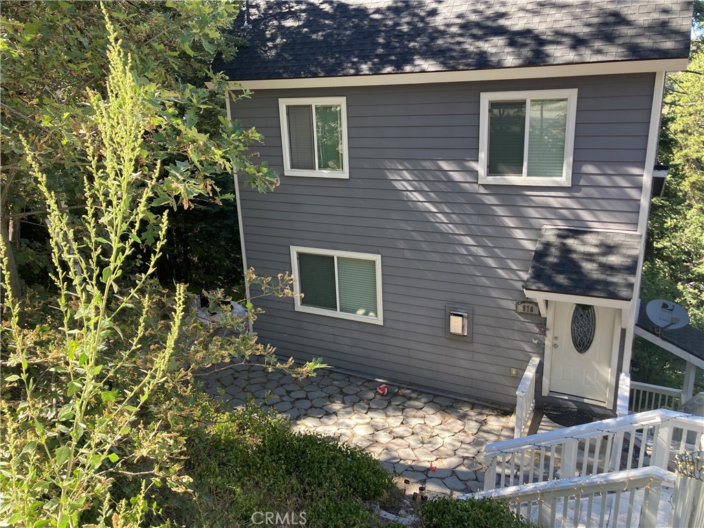 Welcome to 567 Rose lane! 3 bedroom 2 bathroom PLUS studio apartment with kitchen and own entrance! Great opportunity for rental income. This home also has a finished attic - actual square footage of this home is over 2000! Close to the main road and restaurants, this home is commuter friendly. Close to amenities but also ideal for nature enthusiasts with plenty of hiking trails and outdoor activities nearby. Less than 5 miles from Lake Gregory Regional Park and Lake, this property offers easy access to recreational. Built in 2014 the home has granite countertop and newer cabinets throughout even in the basement apartment! The home also has a FIRE SUPPRESSION SYSTEM, so you can feel safe in your new mountain home. The convenience and forrest charm of this property is unbeatable.