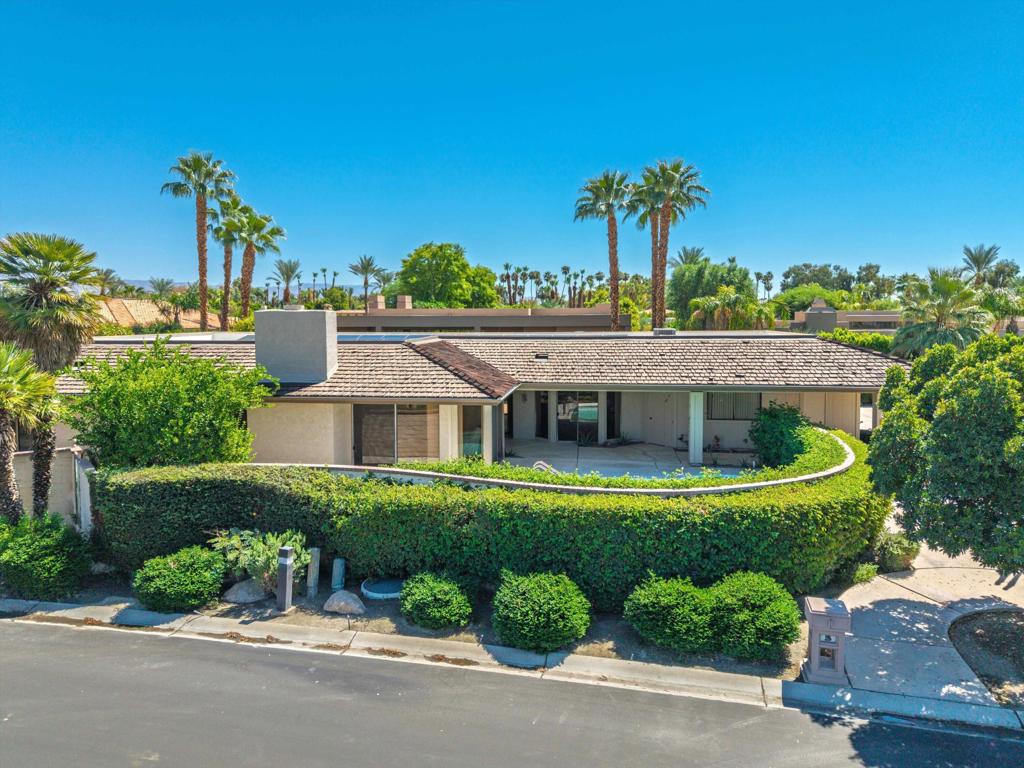 Beautifully updated St. Andrews plan (free standing) with private pool/spa and West Mountain views. Double door entry leads into a home with Versaille pattern travertine floors (carpet in bedrooms) The kitchen is a chef's dream - custom cabinets with lots of accessories (spice risers in drawers, baking tray cupboard, every cupboard has a pullout, double bin pullout for trash/recycling - you get the idea.) JENN AIR appliances: Refrigerator has water dispenser, ultra quiet dishwasher, oven, microwave, warming drawer, 5 burner gas stove with push button ventilation system. Large ''L'' shaped wet bar has an ice maker & white wine cooler. Laundry has washer, gas dryer, and deep soaking sink. Ceiling fans and custom window coverings throughout the home. The former sauna has been converted into a third closet in the primary bedroom suite. Keyless keypad leading to the garage. Outside patios are designed for entertaining and surround this home with outdoor kitchen, gas fire pit, sun deck, outdoor dining and pool spa retreat at your disposal. This property also has 30 solar panels that are owned. 2 car garage with additional Golf Cart Garage and plenty of extra off street parking for 4 vehicles which is rare in the Springs CC. World class Golf, tennis, pickleball, fitness, dining and exclusive events are all available at The Springs Country club. With the $16 million dollar Desmond Muirhead-designed golf course renovation due for completion in November of 2025 - it's time to come see The Springs- where Legacy meets the future!