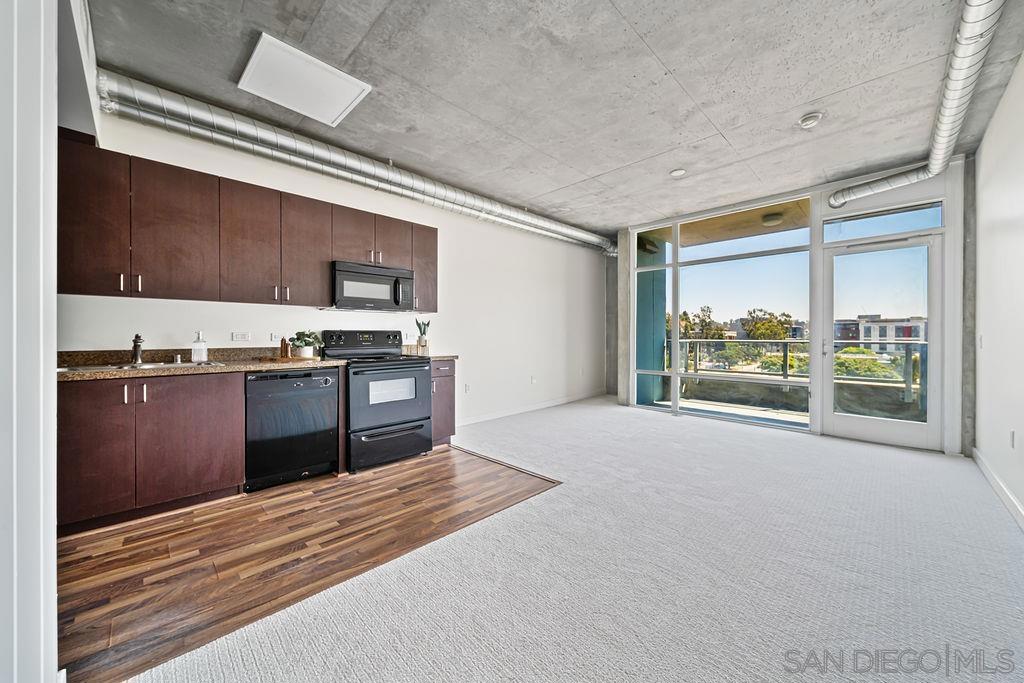 Welcome to Smart Corner, where convenience meets contemporary living. Enjoy fresh interior paint, newly installed carpet, and updated bathroom finishes. This unit offers an open, light-filled layout with exposed concrete accents and stunning floor-to-ceiling windows. Located just steps from the trolley stop and with easy access to the 5, 163, and 94 freeways, commuting is a breeze. Enjoy on-site retail like Starbucks, Subway, and 7-Eleven right outside your door. Residents also have access to amenities, including a rooftop spa with panoramic city views and a fully equipped gym. Perfect for urban dwellers who love style, convenience, and downtown energy.