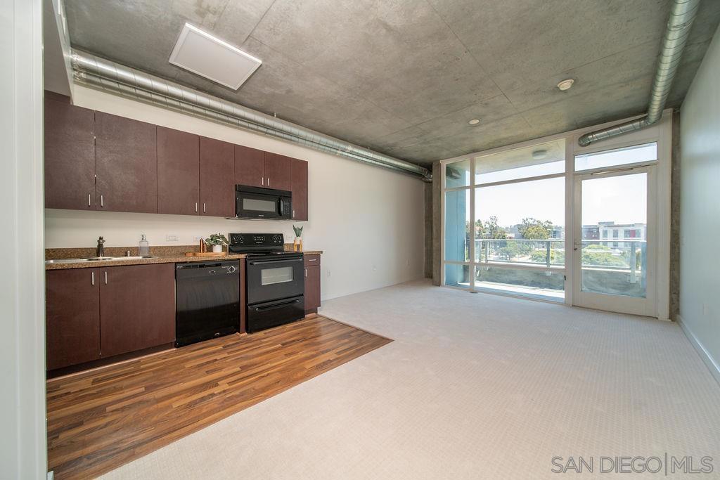 Welcome to Smart Corner, where convenience meets contemporary living. Enjoy fresh interior paint, newly installed carpet, and updated bathroom finishes. This unit offers an open, light-filled layout with exposed concrete accents and stunning floor-to-ceiling windows. Located just steps from the trolley stop and with easy access to the 5, 163, and 94 freeways, commuting is a breeze. Enjoy on-site retail like Starbucks, Subway, and 7-Eleven right outside your door. Residents also have access to amenities, including a rooftop spa with panoramic city views and a fully equipped gym. Perfect for urban dwellers who love style, convenience, and downtown energy.