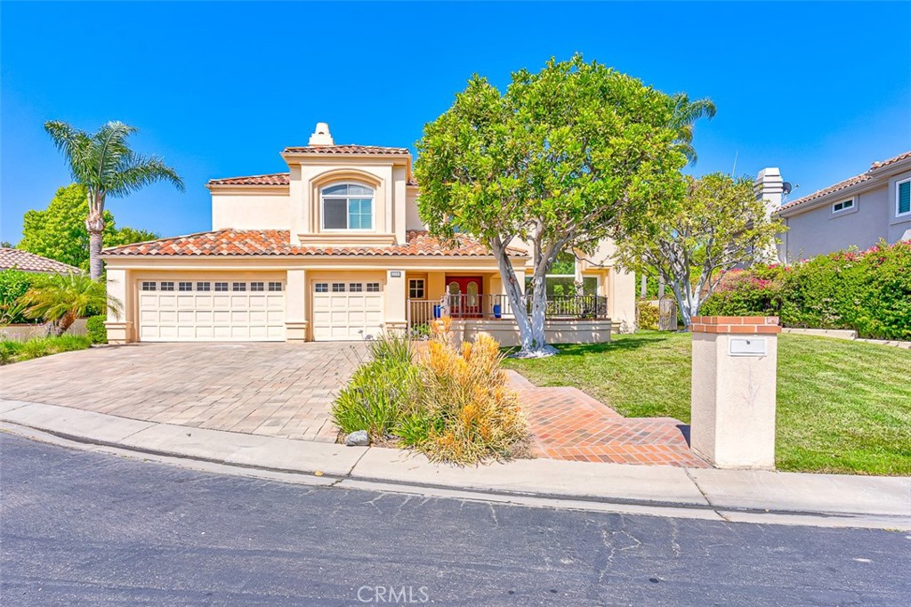 Absolutely stunning home in one of only two gated communities in Villa Park. This home is remodeled head to toe with custom touches and upgrades in every room. Enter through the gated rose garden courtyard to the double door entry and dramatic double height foyer and living room, sure to excite any guest. Entertain by the oversized pool with separate spa while you make dinner on your built in 42-inch gas grill surrounded by lush, mature landscaping including 30-foot-high trees along your garden wall. No expense was spared with newer hardscape in the front and back yard, as well as pool and spa resurfacing with Pebble Tec. Natural light abounds with cathedral ceilings in the formal living room and dining room. An open concept kitchen with brand new French white oak flooring and custom floor to ceiling cabinetry. A breakfast nook, large center island with 6-burner gas cooktop and adjacent family room makes up the heart of the home. On the main floor you'll also find a bedroom, full bath and enclosed laundry room. The 3-car garage is direct access. Upstairs is a large and light-filled secondary bedroom with en-suite full bathroom. The primary bedroom is gorgeous, drenched in light and beyond spacious, with a lovely retreat area including a gas fireplace that could also serve as a home office or be built out as a fourth bedroom. The oversized primary bathroom features dual sinks, a jetted soaking tub, oversized walk-in shower with double shower heads and a fabulous walk-in closet with built in cabinetry all around. Located in gated and very private Villa Park Orchards near Villa Park Elementary and High Schools. Very Low HOA. No Mello-Ross.