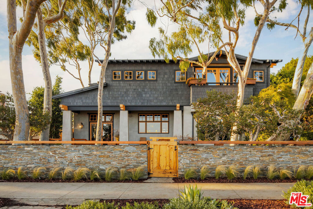 Located on one the most coveted and widest bluff streets in Pacific Palisades, this meticulously composed Craftsman-inspired home occupies the prized corner lot surrounded by endless ocean views and stunning mature trees. Distinguished by the inherent privacy of the locale, this custom designed residence encompasses five bedrooms and four bathrooms exuding warmth and character afforded by precise craftsmanship, artisanal detailing, high ceilings, majestic natural light, and beautiful landscaping. A perfect entertaining home - where the indoor-outdoor flow is in sync with the rhythm of the ocean, which is visible from nearly every vantage point, including the kitchen, family room, breakfast room, dining room, and primary suite. The home's rear grounds encompass an expansive and carefully landscaped lawn, while the separate guest suite off the detached and gated garage offers additional opportunities to host family and friends. A location that is enviable with close proximity to esteemed local schools, Temescal Canyon Park, and the shops, restaurants, and markets of Palisades Village. This truly is a rarefied offering where the pedigree of architecture, design, craftsmanship, location, and spectacular ocean views come together perfectly.