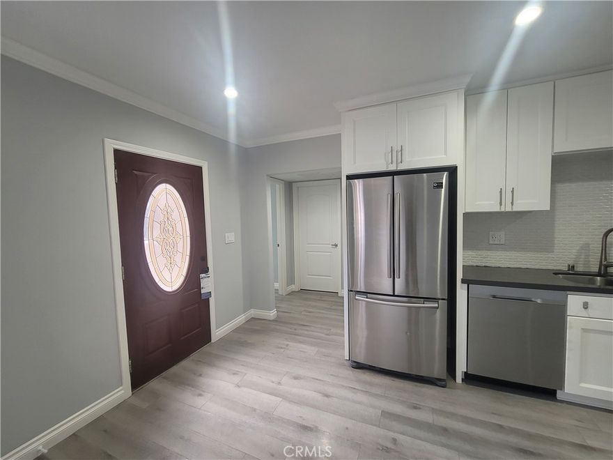 Discover this beautifully remodeled and fully private ADU, perfectly located near the 405 freeway, Ventura Blvd, top restaurants, shopping, and Pierce College. This 2-bedroom, 1-bath home is completely separated from the main house by a fence and features a bright open floor plan with a spacious living room and kitchen, stainless steel appliances, private laundry room with hookups and storage, laminate flooring, and central A/C. Enjoy your own enclosed patio and outdoor seating area ideal for relaxing or entertaining. A modern and convenient home in a prime location!