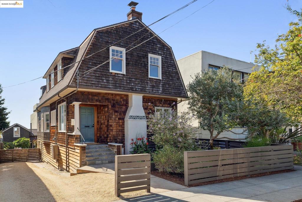 This charming multi-family compound in North Berkeley offers the quintessential Berkeley lifestyle. Located moments from famed East Bay restaurants, shops, the first Peet's Coffee, and essential amenities. The main home is a preserved turn-of-the-century brown shingle farmhouse, featuring intricate oak fireplace mantels, coved ceilings, leaded glass built-ins, and Douglas fir floors. It includes three bedrooms, an office/bonus space with bay views, two bathrooms, and an eat-in kitchen with a walk-in pantry, O'Keefe & Merritt stove, and a back deck with bay views. Complementing the main house, a private back cottage offers a versatile living space with one bedroom, a full bath, integrated living and dining areas, original Douglas fir floors, an upper loft, and a deck with Bay & Golden Gate Bridge views. The lot features shared and private garden spaces, multiple decks, and a freestanding garden studio, enveloped by lush plantings. A long driveway provides ample off-street parking. The main house also includes a full basement for a workshop, storage, and utility. Enjoy waking up to North Berkeley right at your fingertips, or revel in the convenience of living just a stone's throw from Live Oak Park and the renowned UC Berkeley campus.