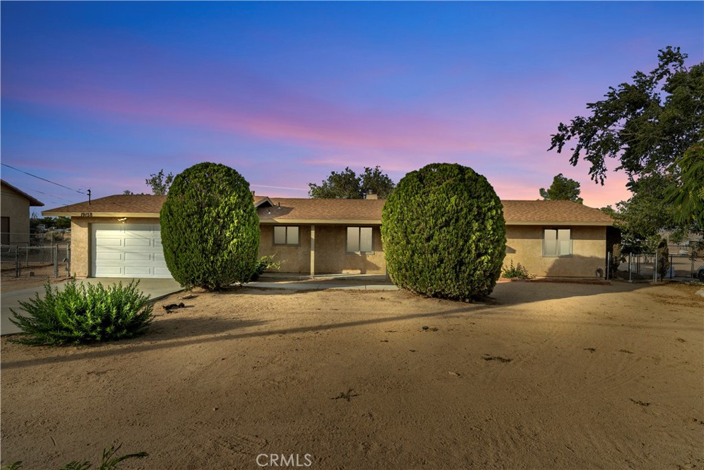 Very nice home, in a great Hesperia neighborhood. 3 ample bedrooms, 2 nice baths, 1,377 square feet. 4th "bonus" room could be an additional bedroom/office/den etc. The home is nicely refreshed with new paint, some flooring, countertops, appliances, etc. so this house is VERY ready for you to move in! Huge 19,000 square foot lot, low-maintenance, nice DG, and attractive landscaping. 2 car garage, attached. Nice open floor plan, kitchen and dining room open to pleasant living room, with fireplace. Central heat, and vented swamp cooling. Kitchen is refreshed, with new countertops, paint, floor, and quality newer appliances. Both bathrooms have been refreshed as well, with counters, paint, etc. Tile floors throughout home, for cool living. Covered patio area in back, great for evening dining or relaxing in the shade. Big 2-car garage with laundry hookups, and direct access to kitchen. A great location in Hesperia, in a quiet neighborhood. Come make this lovely home your own!