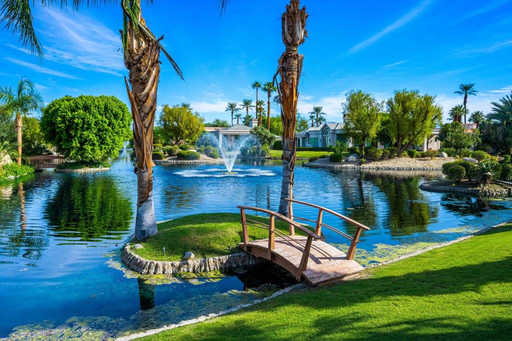 A rare opportunity to own one of only five homes in Waterford with unobstructed views across the lake. This immaculate 4 bedroom, 4.5 bathroom architectural gem was designed by the celebrated Narendra Patel. Waterford is a beautiful Custom Home Development perfectly positioned in the heart of Rancho Mirage. Close to several top flight Country Clubs.This home exudes warmth and elegance and has been lovingly cared for since its construction by the present owner.The open plan great room with dramatic fireplace has that special sought after view overlooking the beautiful Waterford lake. Short walking distance to the private tennis courts within the development.