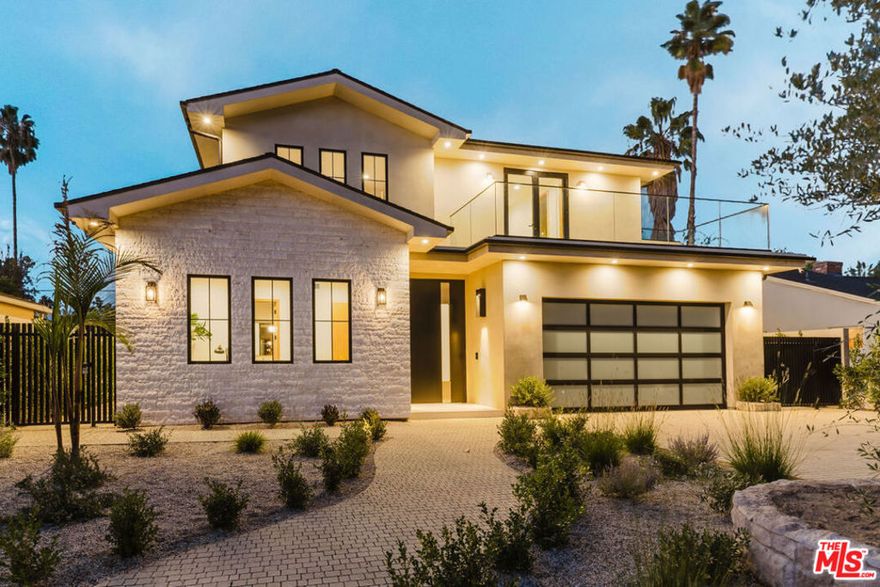 Introducing a new built architectural masterpiece that epitomizes modern elegance and luxurious design. Encompassing approximately 4,000 square feet of exquisite finishes, the main residence offers five spacious bedrooms and four and a half baths, a detached 1BR / 1BTH ADU, and several outdoor spaces. The heart of the home is an open living space, featuring a gourmet kitchen and an airy breakfast nook. The living area flows seamlessly outdoors to a private oasis, complete with a pool and spa, a chic BBQ area, and a heated covered patio, perfect for entertaining. Upstairs you'll find a stunning primary suite, with a dazzling bath and a walk in closet, additional three bedrooms and two baths, and two large balconies. The ADU provides additional flexible space for guests, yoga studio, or an office, for a trendy and sophisticated lifestyle. This home embodies contemporary opulence in the heart of Valley Village, crafted for those who appreciate style, luxury and functionality.