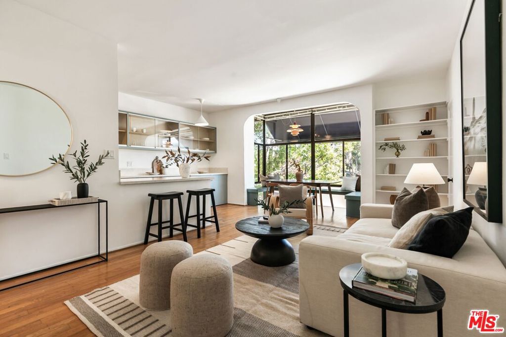Stunningly updated 2 Bed & 2 Bath top floor, corner condo that is awash with natural light all day long. The unit blends modern comfort with effortless style, offering a townhouse feel without any of the hassle. Nestled on a charming tree-lined street, this home features an open floor plan with hardwood floors and sleek, high-end finishes. Step into the spacious living/dining area that opens to an updated gourmet kitchen with quartz countertops, custom cabinetry, newer stainless steel appliances and a breakfast bar. Both bedrooms are generously sized with ample closet space and both of the bathrooms have been luxuriously updated.. Also features in unit laundry, high ceilings, private patio area, engineered hardwood floors with extra sound proofing, updated electrical subpanel, brand new solar water heater, new skylight in primary bathroom and more! Small 16 unit gated/secured building that offers an array of amenities, including a heated pool, spa, sundeck with community BBQ, and paddle tennis court + high speed internet and premium cable included . Located just a few minutes from the vibrant shops and cafes on Main Street and the beautiful Santa Monica beaches, 643 Bay St is the epitome of relaxed, luxury living. Don't miss your chance to call this modern gem your home!