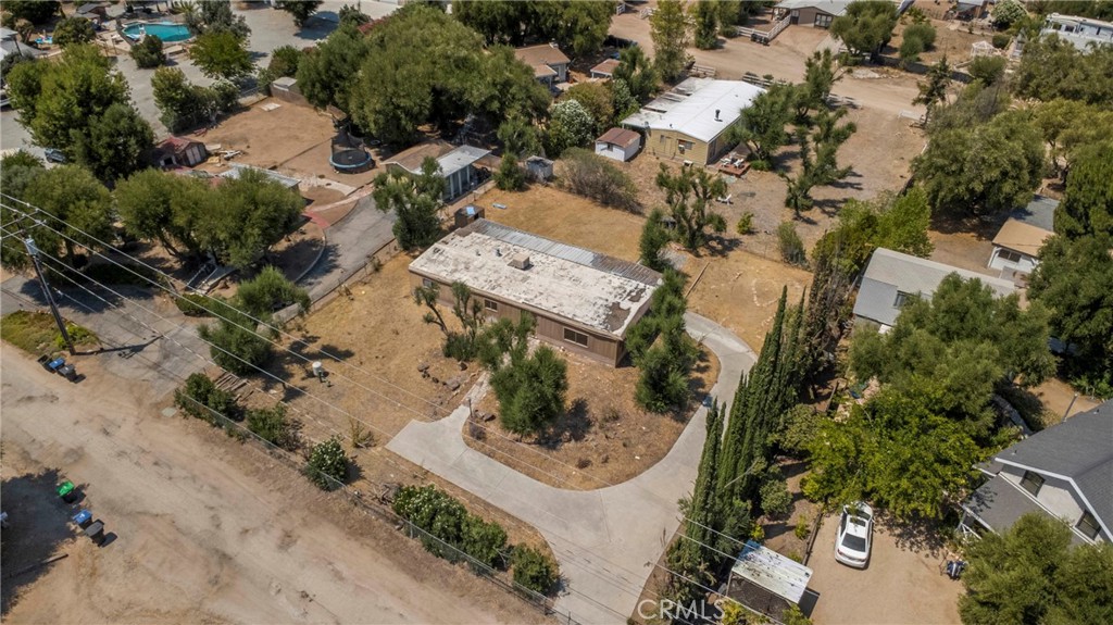 Positioned in the wonderful Wildomar community, this property combines natural beauty with investment flexibility. Set on a generous 0.35-acre lot, the 1972 manufactured home offers 2 bedrooms, 2 bathrooms, and 1,440 sq ft of living space — a solid foundation for redevelopment!
The home is serviced by city water and a private well water for agricultural use.
With no HOA and a low tax rate, this is a low-carrying-cost investment. The expansive lot provides endless possibilities — from RV/boat parking and outdoor storage to redevelopment. Options include renovating the current home, using it as an income property, or removing the existing mobile and replacing it with new construction or a modern manufactured home.
Conveniently located close to Ortega highway and just minutes from I-15, this property ensures easy access for commuters, renters, and future buyers. Coupled with its scenic setting and versatile lot, it offers multiple pathways for strong returns