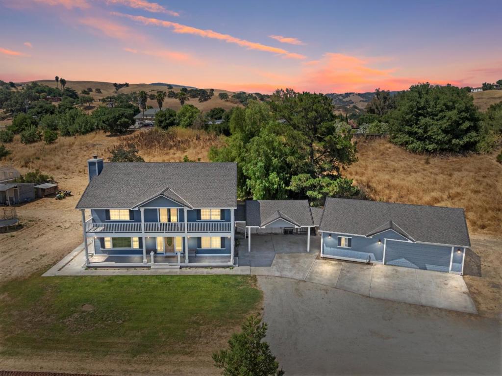 Welcome to this spacious four-bedroom, three-bathroom home nestled on just under 5 flat, usable acres in the beautiful countryside of Hollister. This property offers the perfect blend of peaceful rural living with the convenience of being just a short drive from all that Hollister has to offer. The home features a thoughtful layout with generous living space and endless potential to make it your own. Whether you're looking to create a homestead, add a workshop (buyer to research and confirm), or simply enjoy the wide-open space, this land gives you the freedom to paint your own picture. The two-car garage includes two additional storage rooms, offering plenty of space for tools, hobbies, or extra belongings. With its ideal location and solid foundation, this property is a rare opportunity to own a slice of the country without giving up access to shopping, dining, and schools.