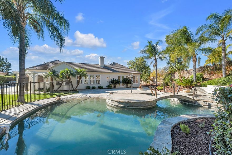 Welcome to 5853 Spirit Lake Ct,  a rare single-story jewel in the coveted Shadowhawk enclave. Situated on nearly half an acre of pristine, usable land, this 4 bedroom + bonus room, 3.5 bath executive residence offers timeless elegance, privacy, and a resort style outdoor escape.
Located on a premium corner lot, the home welcomes you with a gated courtyard and a bright, open interior featuring soaring ceilings, new flooring, and abundant natural light. The fully reimagined gourmet kitchen stuns with quartz counters, custom cabinetry, SubZero & Viking appliances, and a spacious butler’s pantry,  all opening to an inviting family room with built-ins and a fireplace.
Retreat to the expansive primary suite featuring a private fireplace, spa-like bath, and direct backyard access. Secondary bedrooms offer Jack & Jill configurations and ample flexibility. A dedicated theater room provides the perfect space for movie nights and immersive entertainment.
Outside, your private oasis awaits,  enjoy a Pebble Tec beach entry pool with rock waterfall, spa, slide, fire pit, custom planters, fruit trees, and space to entertain or expand (ADU potential). Bonus: paid solar, gated RV parking, and exclusive easement access unique to this home.
Conveniently located near trails, dining, award winning schools & the 118 freeway. This is more than a home,  it's a lifestyle.