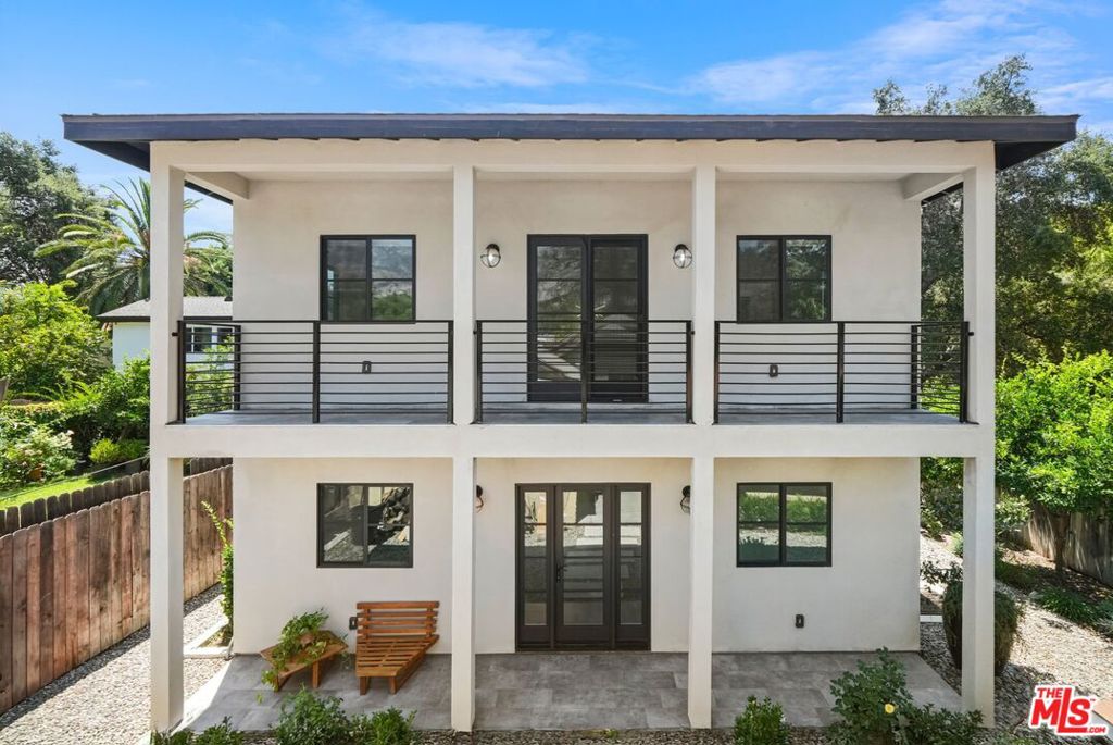 Recently constructed with timeless design, this Altadena residence offers a rare blend of elegance, privacy, and California lifestyle. Natural light fills every room, highlighting open living spaces and thoughtful finishes throughout. Each of the three bedrooms is a private suite, complete with its own walk-in closet and full bathroom an ideal combination of comfort and sophistication. The grounds are truly special, featuring fruit trees, blooming roses, and vibrant gardens that create a serene retreat. Multiple outdoor areas including front, back, and side patios, a welcoming porch, and a private balcony invite seamless indoor-outdoor living. Shaded seating areas provide the perfect setting for barbecues, gatherings, or quiet evenings surrounded by mature trees and mountain views. Located within minutes of Pasadena's dining, cultural destinations, and top-rated schools, this property combines convenience with a true sense of retreat. Homes of this caliber are rarely available an opportunity designed for those seeking more than just a place to live.