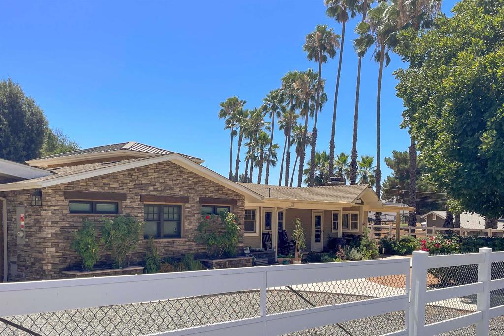 Fully remodeled in 2020, this stunning 3 bed, 3 bath home, set on a generous 0.95 acre lot in beautiful Eucalyptus Hills has all the special extras! With 2,320 ESF of thoughtfully designed interiors, this property offers the space, comfort and style you’ve been looking for. You'll love the versatile 600 ESF open concept bonus space with a kitchen and bathroom, you’ll have endless possibilities for hosting, or reimagining! You'll also find a separate one-car garage, storage room, and designated RV parking with full hookups, it’s truly an East County dream! Inside, enjoy two spacious bedrooms with ensuite bathrooms, a living room, family room with cozy fireplace, and a dedicated laundry room. The chef’s kitchen is a showstopper, featuring premium JennAir appliances, a Sub-Zero refrigerator, and elevated finishes throughout. Additional upgrades include dual pane windows, two A/C units, a whole house fan, paid solar, and a wired generator for backup power. Step outside to enjoy a fully fenced yard with vinyl fencing, gated entry, over-sized covered carport area, fruit trees, and a relaxing jacuzzi. Your morning coffee will taste better while strolling your own private oasis. Don’t miss this one!