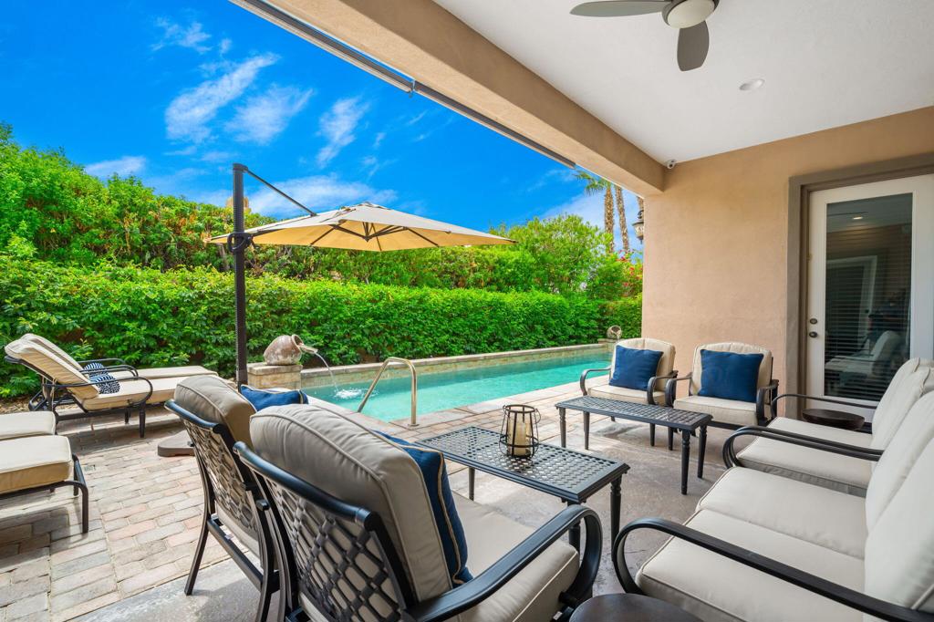 Experience elevated desert living in this stunning 5-bedroom, 4.5-bathroom home located in the highly sought-after gated community of Rancho Santana in La Quinta. This spacious, thoughtfully designed residence blends upscale finishes with everyday functionality, offering the perfect retreat for families, entertainers, or anyone seeking the ultimate desert lifestyle.From the moment you step through the front door, you'll be welcomed by an open-concept floor plan filled with natural light and seamless indoor-outdoor flow. The chef's kitchen features high-end stainless steel appliances, granite countertops, a walk-in pantry, and a central island that anchors the space--perfect for entertaining or simply enjoying a quiet morning at home.The luxurious primary suite is your own private escape, complete with a spa-like en-suite bathroom that includes dual vanities, a soaking tub, a walk-in shower, and an expansive walk-in closet. For guests or extended family, the attached casita offers the ideal balance of connection and privacy, with its own separate entrance and an elegant en-suite bathroom.A large bonus room adds flexibility for your lifestyle--use it as a home office, media room, workout studio, or convert it into a sixth bedroom. Every inch of this home was designed with comfort and convenience in mind.Step outside into a beautifully landscaped backyard oasis, where a sparkling pool and spa are enhanced by tranquil water features. Enjoy evenings by the fire pit, weekend cookouts at the built-in BBQ island, and peaceful mornings in your own private sanctuary. This outdoor space is built for year-round relaxation and entertaining.Rancho Santana is known for its charming walking paths, lush greenbelts, bocce ball courts, putting greens, playground, and community park--all with low HOA fees. And with a central La Quinta location, you're just minutes from top-rated golf courses, tennis and polo clubs, scenic hiking trails, fine dining, upscale shopping, and the charm of Old Town La Quinta.Furnishings are negotiable, making this an easy move-in-ready opportunity. Don't miss your chance to own a slice of desert paradise. Call today to schedule your private showing and experience everything this home--and the La Quinta lifestyle--has to offer.