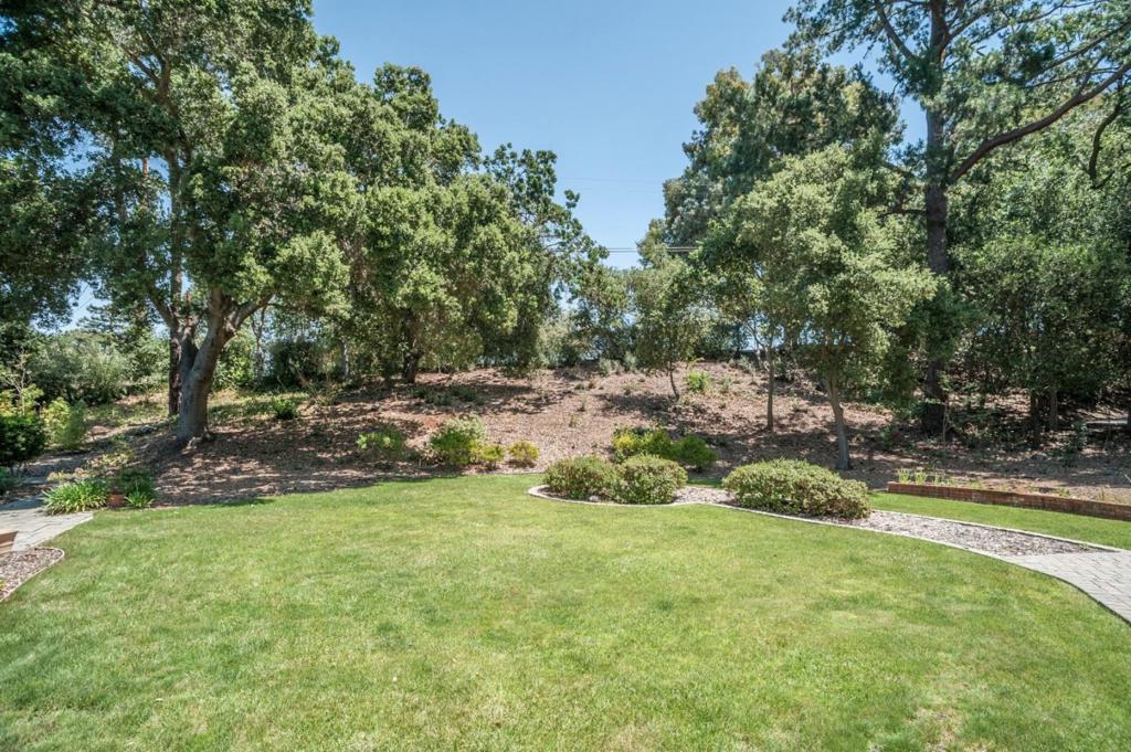Prominently located across the street from the prestigious Los Altos Golf & Country Club! This 13,530sqft+/- lot is nestled on luscious grounds and mature oak trees. Build your dream home (3300+/-sqft) on this picturesque creekside setting! Building site approval! Top Los Altos School District!