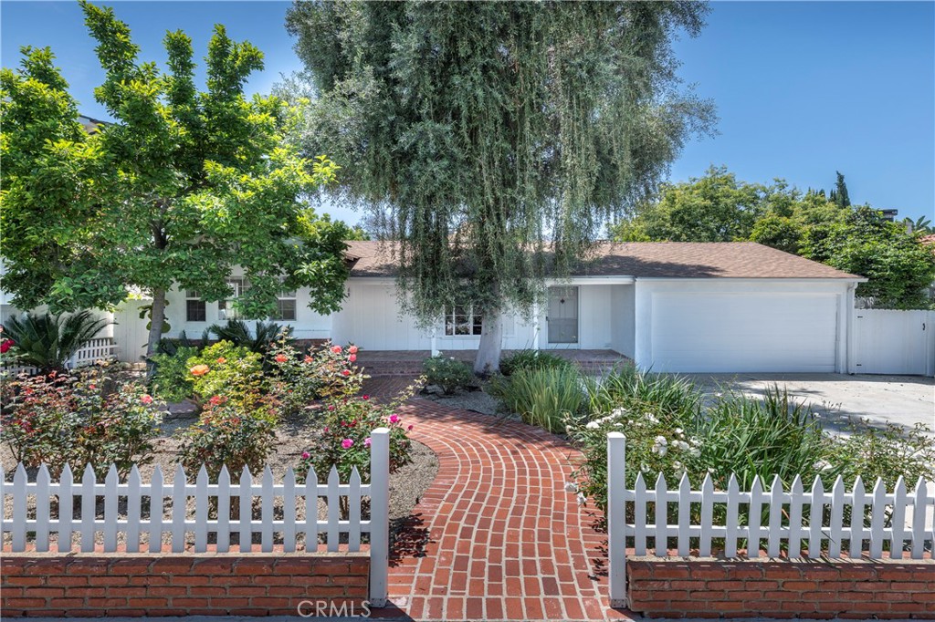 Nestled south of Ventura Boulevard in the highly sought-after Sherman Oaks neighborhood, this enchanting three-bedroom (possible 4th bed), three-bathroom home is the perfect fusion of classic charm and contemporary convenience. Step into the inviting living room, where a stunning Elmira wood-burning stove takes center stage, infusing the space with cozy warmth and timeless character. Hosting is a breeze with the unique Keyway post mix soda system, complete with CO2 containers on the side of the house, bringing a professional touch to your gatherings. Stay comfortable year-round with two state-of-the-art HVAC air conditioning systems installed just two years ago. The newly upgraded ductwork throughout the home maximizes energy efficiency, keeping utility costs low and comfort high.There is a Tesla 220 line installed for charging. The roof, a mere three years old, promises longevity and reliability, adding substantial value to this delightful property. Enjoy the convenience of nearly new appliances, including a washer, dryer, and dishwasher, all less than a year old. This home is a perfect blend of thoughtful updates and vintage allure, making it an exceptional choice for those seeking a stylish, comfortable retreat in a prime location. Don’t miss your chance to experience the best of Sherman Oaks living!