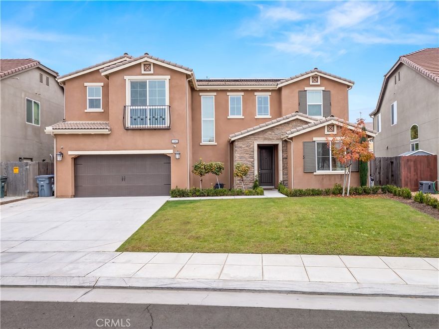 Showcasing owned solar, an electric vehicle charger, and luxurious custom Italian tile flooring, this 2020-built Bonadelle Oak floor plan home delivers the perfect fusion of modern efficiency and high-end design. From the moment you enter, the home’s thoughtful upgrades and contemporary features set the tone for a lifestyle that is both stylish and exceptionally functional. The heart of the home is an impressive oversized kitchen island—perfect for entertaining or enjoying everyday meals. The open-concept layout flows effortlessly into a spacious family room and a formal dining nook, creating an inviting atmosphere for gatherings. A highly desirable downstairs bedroom and full bath provide flexibility for guests, multigenerational living, or a private office. Upstairs, a versatile loft awaits, ideal as a second living area, office, or playroom. Three additional bedrooms include a generous primary suite designed for relaxation and convenience. Set on an oversized lot, the backyard is primed for year-round enjoyment with a built-in covered patio and ample space to design your dream outdoor retreat. Located in the rapidly growing East Clovis corridor, you’ll enjoy close proximity to brand-new shopping centers, scenic Clovis trails, and top-rated schools. Schedule your appointment today to experience all this exceptional home has to offer.