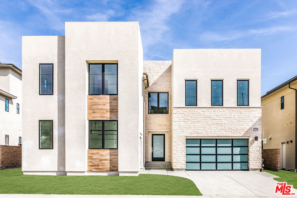 Experience modern luxury in this stunning 5,490 sq ft estate located in the exclusive, guard-gated Westcliffe community of Porter Ranch. Completed in July 2023, this 5-bedroom, 6-bathroom home features a sleek open floor plan, soaring two-story foyer with floating glass staircase, a spacious loft, and an incredible multi-generational suite- a private living space perfect for extended family, guests, or live-in support. Thoughtfully designed for comfort and independence, the suite includes its own living room, private entrance, full bathroom, walk-in closet, and built-in appliances, creating a true home within a home. At the heart of the main living area is a gourmet chef's kitchen, showcasing top-of-the-line Wolf appliances, an expansive Taj Mahal quartzite waterfall island, upgraded custom cabinetry, and a sleek pot filler. The home sits on a premium lot with unobstructed panoramic views of the city and mountains, with no homes directly across the street offering unmatched privacy and breathtaking sunrises and sunsets. Designed with exquisite finishes including custom stone bathrooms, upgraded lighting, oak floors, 2 sets of stacking glass doors and expansive glass windows, and a 72" color-changing crystal fireplace, every inch of this home exudes modern elegance. The primary suite is a luxurious retreat with a large sitting area, colossal walk-in closet, and spa-style marble bathroom. Additional features include surround sound, state-of-the-art home tech, fully paid solar, a three-car garage, and a spacious backyard with an outdoor fireplace perfect for entertaining or relaxing under the stars. Conveniently located near The Vineyards shopping center, Whole Foods, AMC, award-winning schools, and the 118 freeway, this is a rare opportunity to own one of Porter Ranch's most prestigious and breathtaking estates.