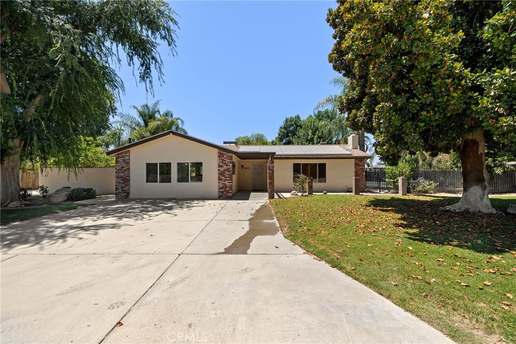 Huge price adjustment which makes this property even better! Bring your horses! Nestled on a generous 1.1-acre lot located in the highly sought after NW. This 2,093 square foot residence offers the perfect blend of privacy and accessibility. The home showcases 4 bedrooms and 2 bathrooms. pool ideal for our hot summer days. Workshop in rear with two full entry doors for RV storage or work area w/ Jr suit with full shower. You will be greeted by mature landscaping throughout the property. The exterior has a covered patio, lush backyard, 4 stall breezeway barn, hay barn, RV access and a pasture for grazing. It also has solar, to provide affordable utilities all year round! Also located in great school districts!