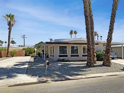 Discover the epitome of comfort and style in this meticulously renovated 2-bed, 2-bath manufactured home nestled within a vibrant 55+ community. Offered for an annual lease OR monthly (seasonal rate applies) FURNISHED and boasting a spacious interior, the focal point is the expansive kitchen featuring a large island, perfect for entertaining or casual dining. With updated countertops, modern appliances, and ample cabinet space, it's a chef's dream. The adjoining living area is bathed in natural light, offering a cozy retreat for relaxation. Both bedrooms are generously proportioned, providing privacy and comfort, while the bathrooms showcase contemporary fixtures and finishes. Outside, a sprawling lot offers endless possibilities for gardening, outdoor activities, or simply unwinding in the serene surroundings. Covered parking ensures convenience and protection from the elements. Residents of this community enjoy access to a range of amenities including pools/spas, golf, tennis/pickleball, and social clubs. Conveniently located near shopping, dining, and recreational options, this home offers both tranquility and convenience. Embrace the charm of 55+ living - schedule your tour today! *Ideal applicants will meet or exceed the following Qualification Standards: verifiable gross household monthly income of 3X the monthly rent, minimum 650 credit score, no previous evictions. Anyone over the age of 18 who intends to occupy the home full time will be required to submit a rental application. Applicants must be approved by HOA.