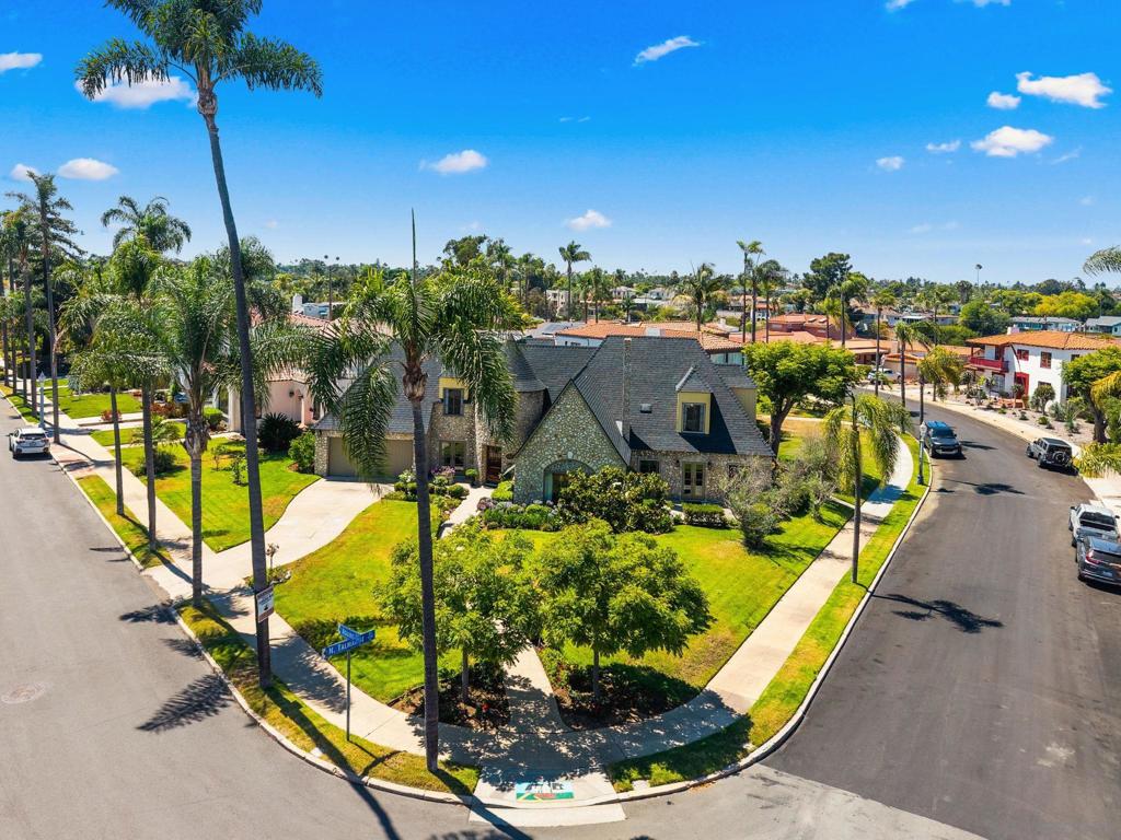 Iconic Kensington Gem! MILLS ACT Designation Offering Significant Tax Savings. Magnificently situated in the coveted Kensington neighborhood on a pristinely maintained corner lot spanning nearly a quarter acre, this architecturally significant four bedroom, three bath residence blends timeless elegance with historic prestige. Known as "The Wonder House of Stone", this grand two-story French Eclectic estate was masterfully designed by renowned local architectural designer Ralph E. Hurlburt and constructed by Los Angeles builder L.J. Faulkner, utilizing the distinguished construction methods of celebrated New York architect Ernest Flagg. Rich in character and historical integrity, the home benefits from Mills Act designation, offering valuable property tax savings. Inside, you’ll discover a thoughtfully designed layout featuring one full bedroom and bath on the main level, ideal for guests or multigenerational living, alongside a light-filled formal living room adorned with striking wood-beamed ceilings and an original wall painting dating back to 1927. As you ascend the staircase, you are met by a charming Romeo and Juliet balcony that looks down into the living room, adding a touch of old-world romance and architectural drama to the upper level. Upstairs, the expansive primary suite is complemented by two additional generously sized bedrooms, each showcasing the grace and craftsmanship emblematic of early 20th century design. An exceptionally rare offering and a true architectural treasure in one of San Diego’s most sought-after neighborhoods.