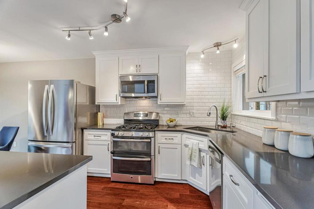 Tucked away on a quiet cul-de-sac, this beautifully updated 2 bed, 2.5 bath townhome offers the ultimate blend of modern style, comfort, and location in one of Aptos' most sought-after neighborhoods. Just minutes from Cabrillo College, Capitola Village, and the beach, it captures the best of California coastal living, while offering a great commute location. Step inside, where soaring ceilings and an open floor plan create a bright, airy atmosphere, while a wall of windows fill the home with natural light. The living, dining, and kitchen areas flow seamlessly, and are perfect for entertaining or everyday living. The remodeled kitchen impresses with quartz countertops, a large island, stainless appliances, and a sleek backsplash; it is ideal for everything from casual mornings to hosting friends and family. Sliding doors open to an expansive deck for effortless indoor-outdoor living. Upstairs, the primary suite is a serene retreat with dual closets, full bath, wood accent wall, and private deck. A second en suite bedroom offers wainscoting, abundant light, and spacious bathroom. Wood floors, updated finishes, low HOA fees, and walkability complete the package. Move-in ready, 3109 Corte Cabrillo offers modern comfort and the easygoing Central Coast lifestyle. Come see today!