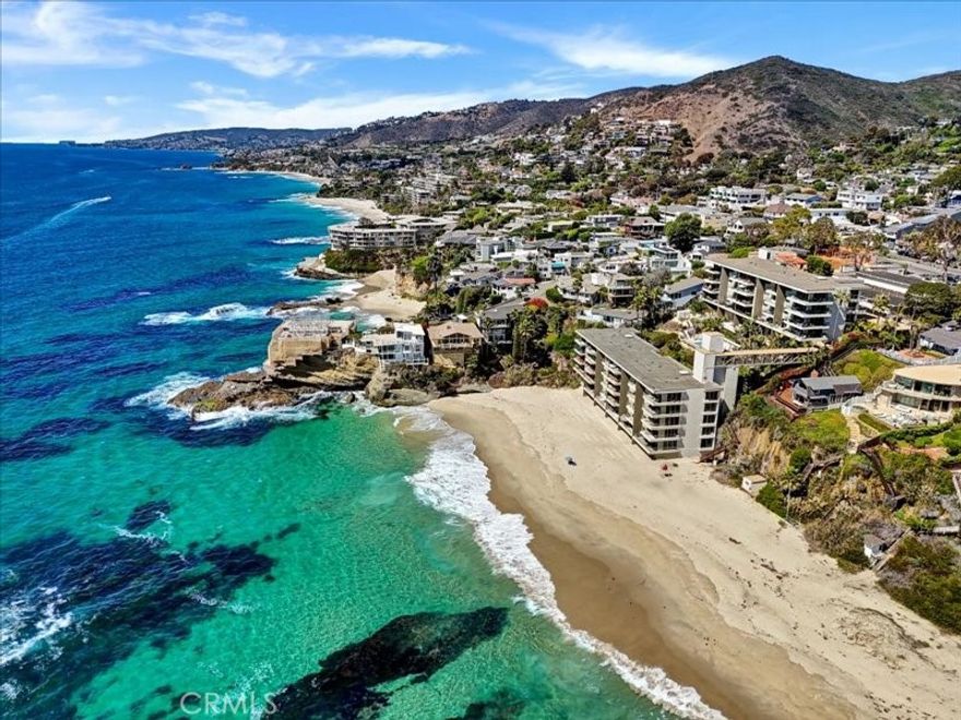 LAGUNA BEACH OCEANFRONT LUXURY CONDO

Wake up to the sound of the waves and panoramic ocean views from this stunning beachfront condo in South Laguna Beach. Perfectly positioned just steps from the sand, this beautifully updated end unit offers seamless indoor-outdoor coastal living. The open-concept floor plan features a bright, airy living area with floor-to-ceiling glass doors that open to a private balcony overlooking the Pacific. Impeccably composed, this 2 bedroom, 2 bathroom home blends timeless craftsmanship with modern sophistication. Every detail has been thoughtfully curated to showcase refined coastal elegance. Property comes fully furnished. Laguna Lido's resort style amenities include a swimming pool, gym and steam room. Located a short distance to world-class dining, art galleries, and boutique shopping, this is coastal living at its finest. Whether you're seeking a full-time residence, vacation getaway, or investment property, this Laguna Beach condo embodies the ultimate Southern California lifestyle.