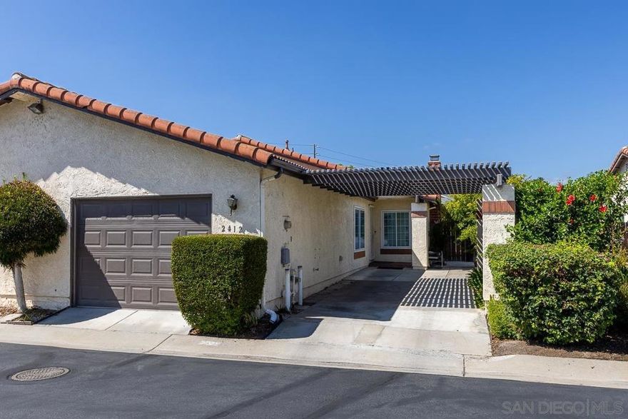 Welcome to this well-maintained 2-bed, 2-bath home located in a highly desirable Escondido neighborhood. The open floor plan with vaulted ceilings creates a bright, airy feel throughout. A versatile bonus room offers the perfect space for a home office, guest bedroom, or playroom. The spacious primary suite includes an en-suite bathroom and generous closet space. Recent updates feature new roof underlayment beneath the tile roof, upgraded flooring, refreshed bathroom vanities, newer appliances. Cozy gas fireplace. Enjoy the convenience of an attached one-car garage with ample storage, plus two additional driveway parking spaces and guest parking within the community. An in-home washer and dryer add everyday ease. Step outside to your private, fully fenced yard—ideal for relaxing, gardening, or entertaining. Close to shopping, dining, and parks, with a low HOA, this property blends comfort, convenience, and charm. Conventional, FHA & VA approved.