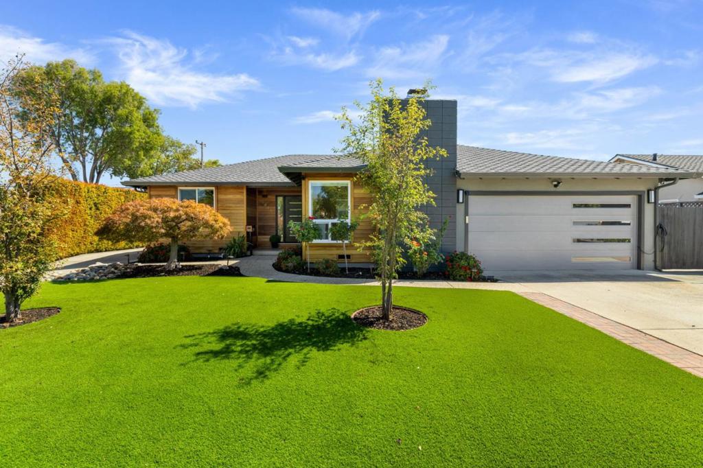 Discover this savvy remodeled single-family home in the heart of Cambrian, offering 4 bedrooms and 3 bathrooms across 1,730 sq ft of designed living space. Situated on a 7,931 sq ft corner lot features extra-wide driveway parking ideal for an RV or recreational vehicle.Step inside to stunning modern finishes and smart home upgrades including: Solar Panels Owned, Tesla Solar storage wall, 2 Tesla Chargers, Nest thermostat, Ring security with interior motion sensors, Ring door bell, Schlage keyless front door entry and more.The open-concept family room showcases a contemporary tiled fireplace with wood mantle, built-in white cabinetry, recessed lighting, and a sleek ceiling fan. The adjacent dining area features its own built-in storage, statement island lighting, and an oversized island with bar seating for three. The gourmet kitchen is a chefs dream highlighted by wood shaker cabinets, open wood shelving, white subway tile backsplash, an oversized stainless sink, Bosch dishwasher, Samsung French door fridge, and a high-end JennAir gas range with downdraft ventilation. Finished garage with epoxy-style stained flooring, storage cabinets, pull-down attic ladder, ceiling-mounted furnace, tankless water heater, stackable Samsung washer/dryer, and Water Right whole-house salt system