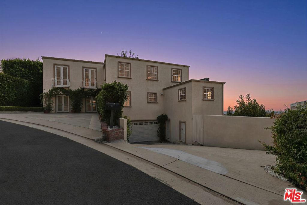 Welcome to this Contemporary Mediterranean retreat with panoramic city views, nestled in one of the most desirable pockets of Los Angeles. This beautifully designed home features 4 spacious bedrooms and 5 bathrooms, offering seamless flow and elevated comfort throughout.The open-concept kitchen is perfectly positioned alongside a warm, inviting family roomideal for everyday living and entertaining. The oversized primary suite boasts dual walk-in closets and a spa-style bathroom, creating a private sanctuary. Additional highlights include a dedicated office and a flexible media/game room, perfect for working or unwinding at home.Step outside to enjoy resort-style amenities: a sparkling pool, park-like grounds, and multiple outdoor areas designed to showcase the stunning skyline views. Natural light pours in through large windows that frame the beauty of the landscape at every turn.
