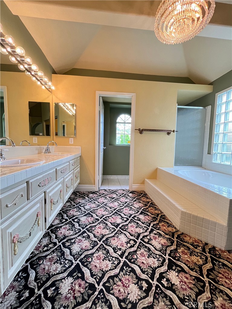 Beautiful and unique 3 br/2 bath single story house with gorgeous grounds. 1941 sq. ft., 8250 sq.ft. lot. Large living room with double sided fireplace. Formal dining area with french doors to a side patio . Family room with fireplace, french doors to the enchanting rear grounds with English style Rose gardens and lush landscaping. Kitchen with copper sink, custom cabinetry, Granite cooktops, gas cooktop, refrigerator, double ovens and dishwasher. Large master bedroom with luxurious master bath, dual closets ( one walk in), separate bubble bath tub and separate shower. 2 spacious additional bedrooms. Full hallway bath with both tub and shower. Inside laundry room with washer and dryer provided, sink and storage. Direct access 2 car garage with attic storage accessible by fold down ladder. Additional driveway parking.Central AC. Gorgeous rear grounds must be seen to be appreciated. Fantastic neighborhood in prestigious Coto de Caza".
