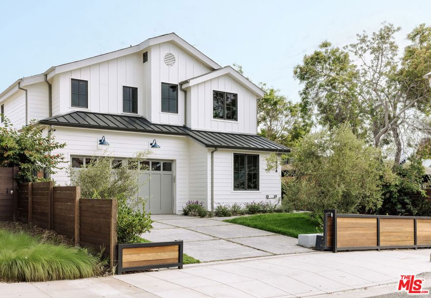 Perfectly positioned on one of Sunset Park's most coveted streets, this beautifully reimagined traditional radiates warmth and light, embodying the timeless sophistication of Santa Monica living. Step inside to discover a dramatic double-height foyer that sets the tone for the rest of the home. The main level features a spacious office, a full guest suite, and a sunlit living room that flows effortlessly into the dining area and chef's kitchen. Walls of glass open to the oversized backyard, creating a seamless indoor-outdoor connection ideal for entertaining or quiet relaxation. Outside, a private sanctuary awaits, complete with a built-in BBQ, outdoor shower, expansive lawn, and a sparkling pool with a retractable cover for year-round enjoyment. Upstairs, the serene primary suite captivates with a cozy fireplace, a massive walk-in closet, and a spa-like bathroom that is filled with an abundance of natural light. Glass doors reveal a large private deck with breathtaking ocean views, making it an ideal spot to unwind and watch the sunset. Two additional bedrooms complete the upper level, each filled with natural light, high vaulted ceilings, and charming details like a built-in library or a hidden loft that kids will love. Filled with light, warmth, and thoughtful design, this home offers the perfect setting to create lasting memories. A true Sunset Park gem, 1726 Pier Street is where comfort, beauty, and community come together.