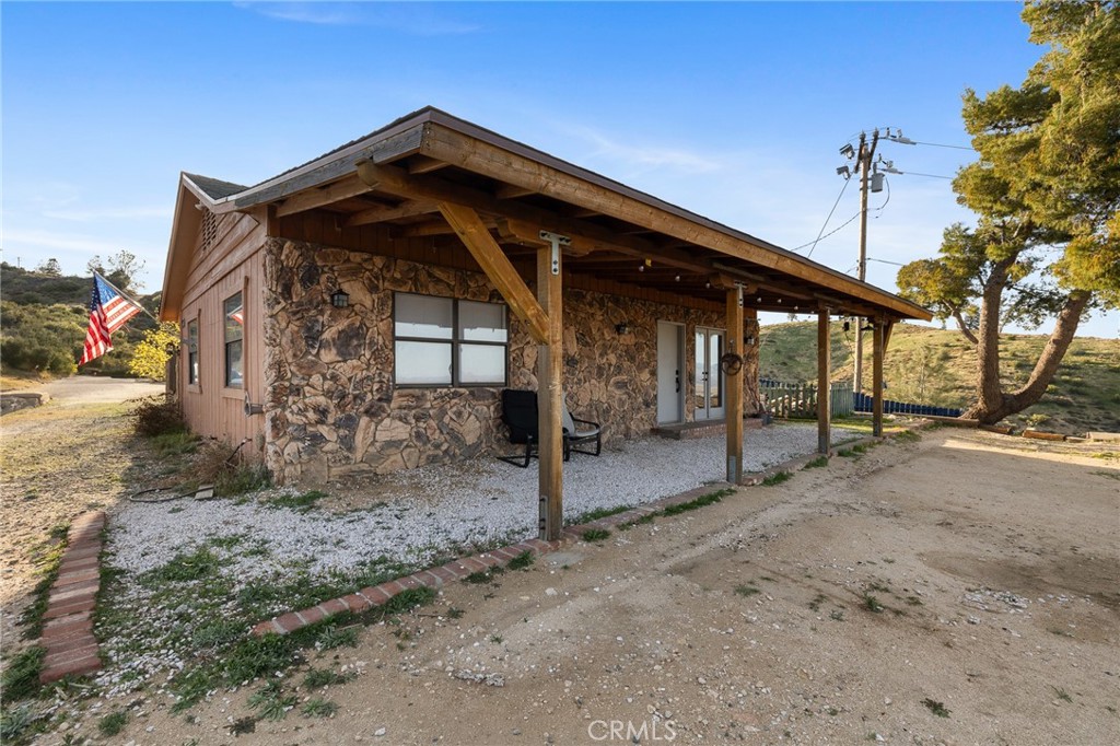 Expansive 5-Acre property with endless possibilities in West Lancaster! A rare opportunity to own a move-in-ready home situated on a sprawling 5-acre lot in one of West Lancaster's most desirable rural communities. Offering unmatched space, privacy, and versatility, this property is perfect for buyers seeking a peaceful retreat with room to grow, build, or invest. The home features a warm and inviting interior with multiple living areas, a functional kitchen, and spacious bedrooms designed for comfort and everyday living. It also comes equipped with solar panels, providing energy efficiency and long-term cost savings—a valuable addition for modern homeowners. Outside, you'll be captivated by the breathtaking desert views and the wide-open landscape surrounding you. The 5-acre flat and usable lot offers boundless potential, whether you're dreaming of adding a second home, building a workshop or barn, setting up horse facilities, or simply enjoying the freedom of wide open space. This property is also a fantastic opportunity for investors looking to subdivide or develop. What makes this property even more desirable is its ideal location—tucked away in a quiet, private setting while still being just minutes from shopping, dining, local amenities, and easy access to the 14 Freeway. It truly offers secluded country living with convenient city access. Whether you're an outdoor enthusiast, equestrian lover, builder, or someone looking for a serene retreat with unmatched flexibility, 46417 Kings Canyon Road delivers. With solar power, stunning views, and five full acres of opportunity, this property is ready for its next chapter. Don’t miss your chance to own this one-of-a-kind Lancaster estate—schedule your private showing today and explore the endless possibilities!