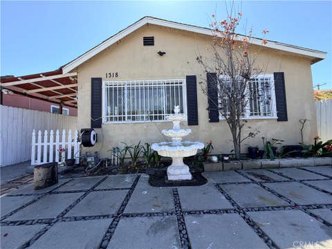 Photo of 1318 E 100th Street, Los Angeles, CA 90002 (MLS # OC26030159)