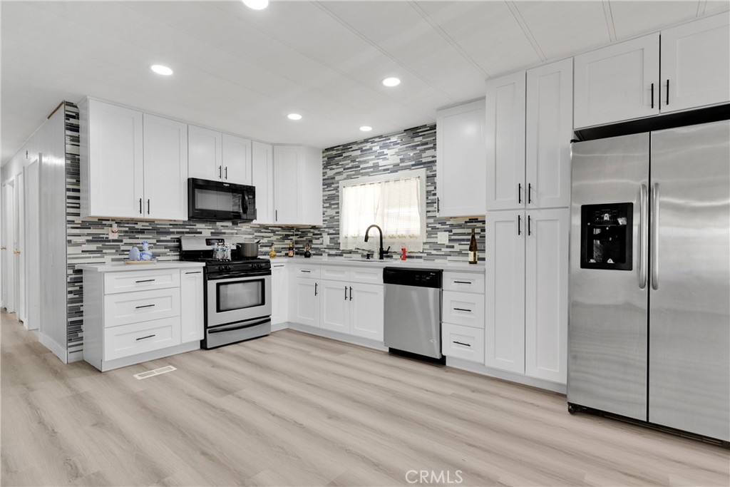AMAZING OPPORTUNITY to own this cozy and charming manufactured home on a permanent foundation on a its own land. This home is completely remodeled and ready for you to move in! Everything from the kitchen to the restrooms, flooring was all renovated. Coupled with central air, it offers a spacious, open layout perfect for modern living. With 3 bedrooms and 2 bathrooms, there’s plenty of room for everyone. The master suite features a spacious double vanity and large tub for relaxation. While the exterior of the home comes with a shed for storage or your own personal workshop! There is no space rent or HOA required for this this home and is close to a golf course, the freeway and local shopping centers. Title shows 2 bedroom 2 bath .